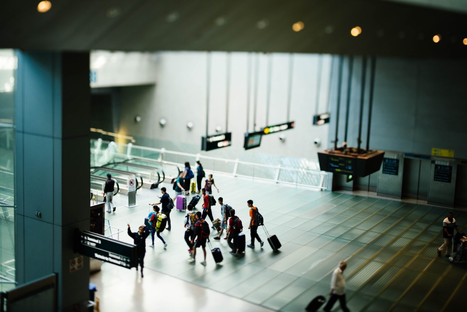 Interior view of an airport crowded with passengers