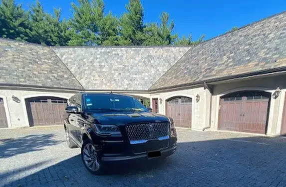 Our luxury Lincoln Navigator stands in home parking