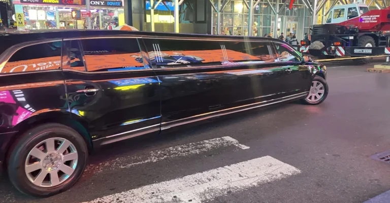 Luxury black limo service Crystal Lake on Road at night