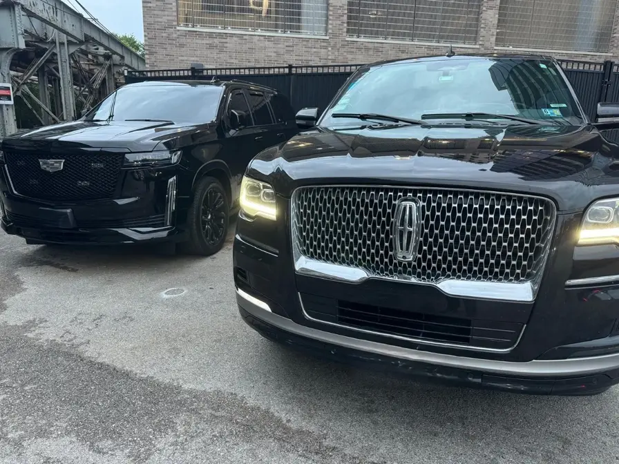 Navigator and Escalade parked